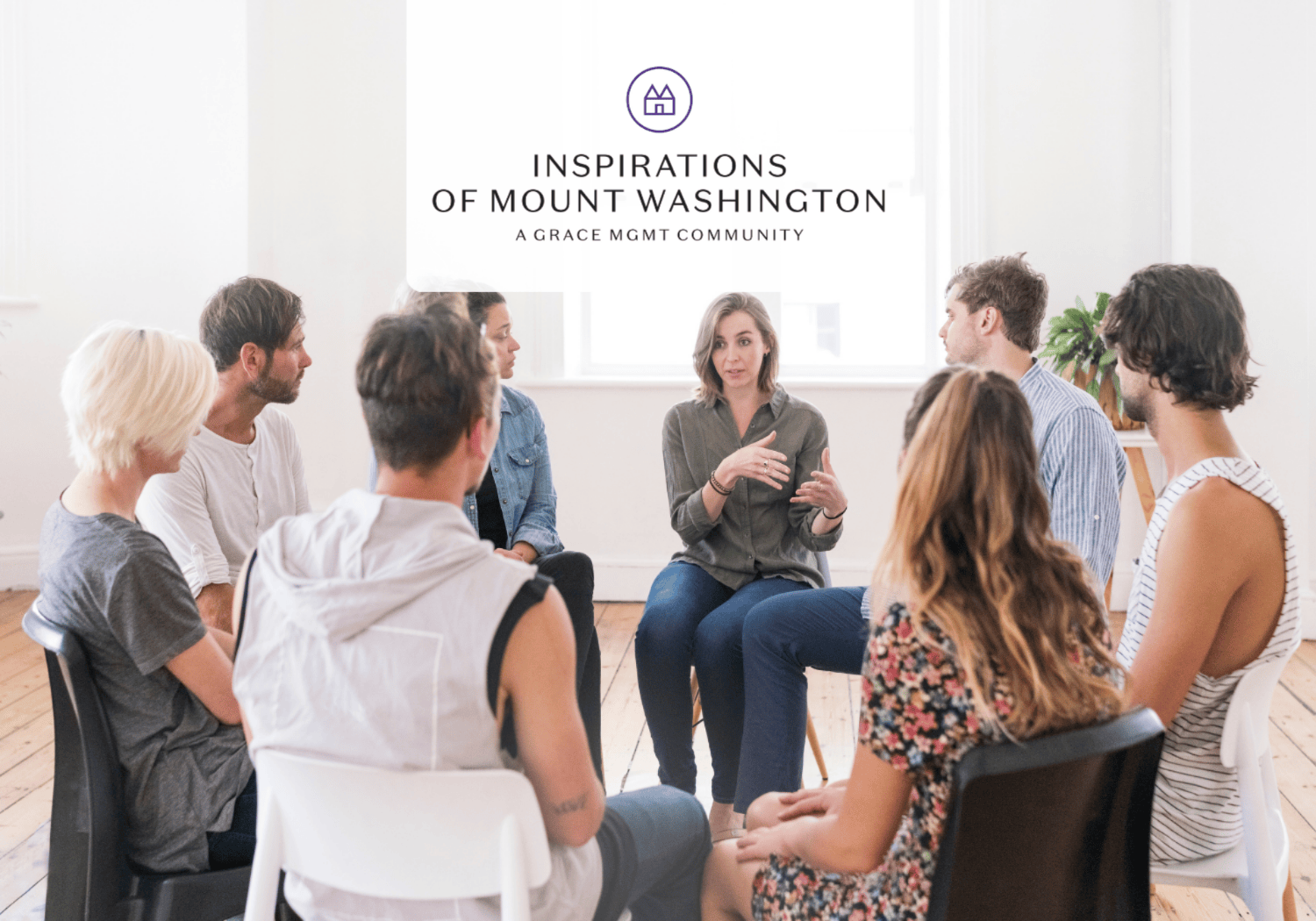 Group of people seated in a circle in a bright room, with a woman speaking in the center; overlay reads 'Inspirations of Mount Washington' (A Grace Mgmt Community).